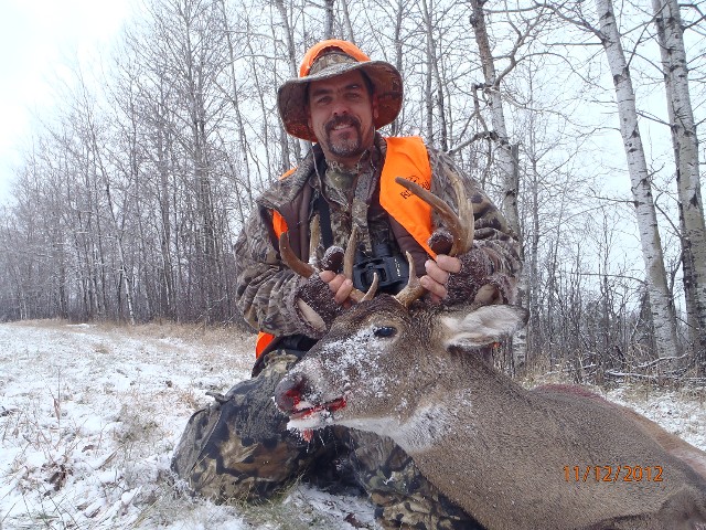 Hunter With Deer in Snow